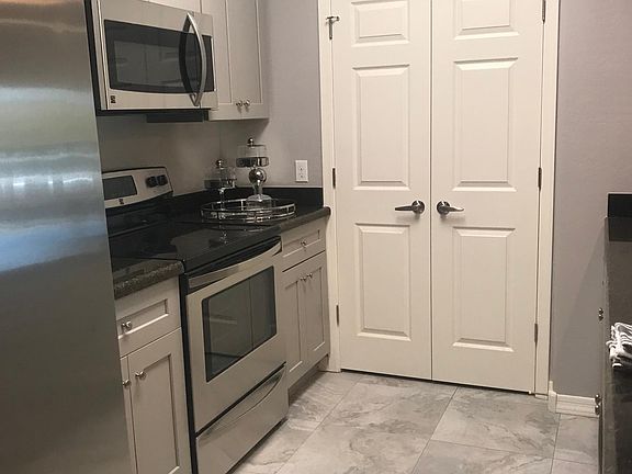 All stainless and granite, with light grey cabinets!