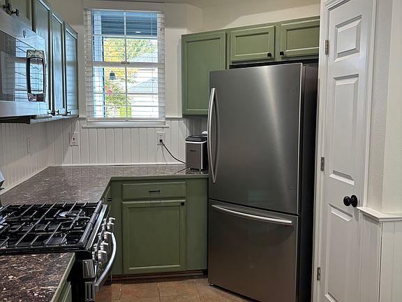 Updated appliances and refreshed cabinets.