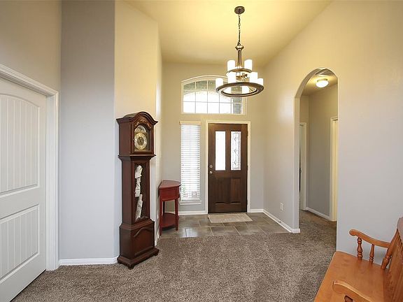 Oversized entry allows access to laundry/garage and secondary bedrooms.