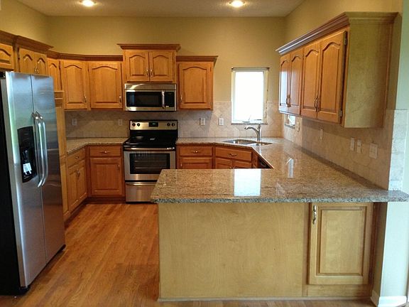 Stainless appliances, granite, travertine