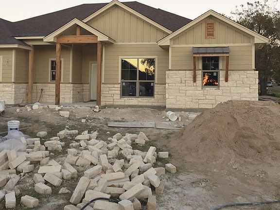 Front elevation
						:
						Austin stone with custom cedar entry