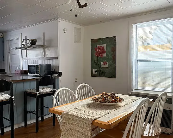 Dining Room: 
Enjoy meals in a bright and welcoming dining area that offers plenty of space for a family table. Featuring easy access to the kitchen, this space is perfect for everyday dining or hosting guests. Large windows provide natural light.