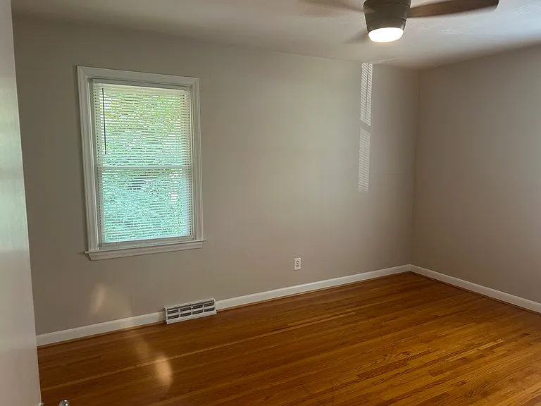 Primary bedroom with ceiling fan and remote. New blinds.