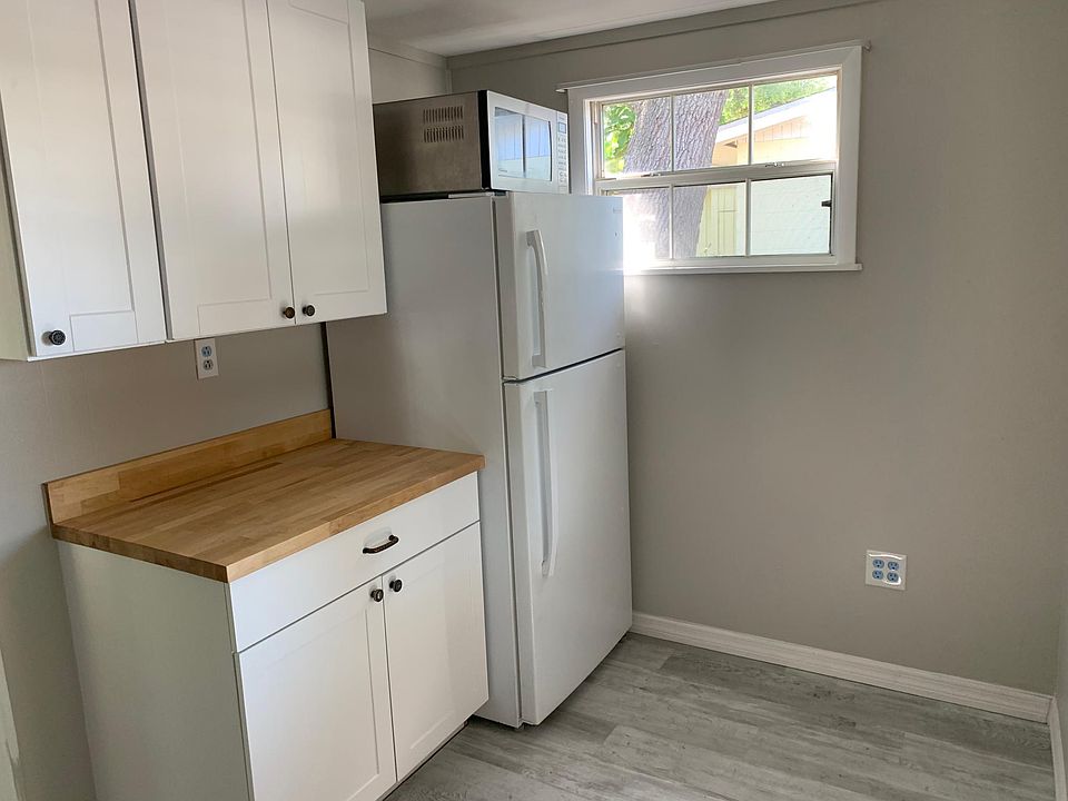 Butcher block countertops, lots of natural light, microwave, refrigerator