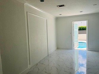 Second exit on to a beatiful backyard with a pool and a jacuzy