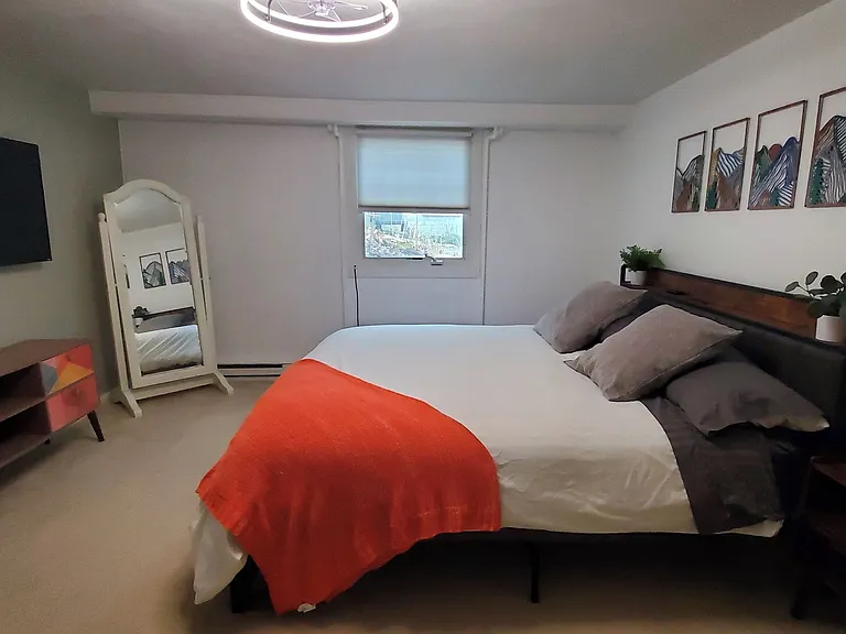 Spacious bedroom with king bed and Roku TV