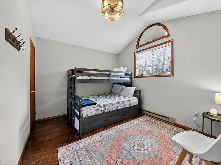 Family-Friendly Third Bedroom _ Featuring a twin-over-full bunk bed and pull-out trundle, this room offers a fun and comfortable space for children, guests, or larger groups.