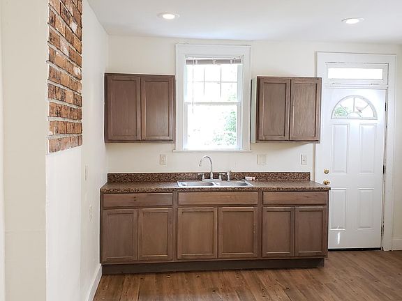 Kitchen: new cabinets, countertop, wood look luxury vinyl planks