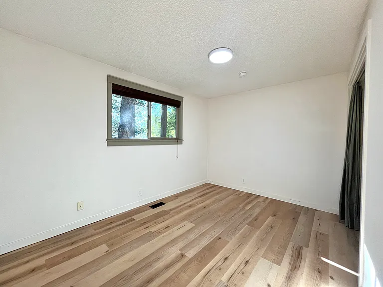 Second bedroom with view to the front yard.