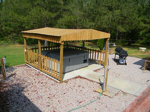 Covered Hot Tub in back yard