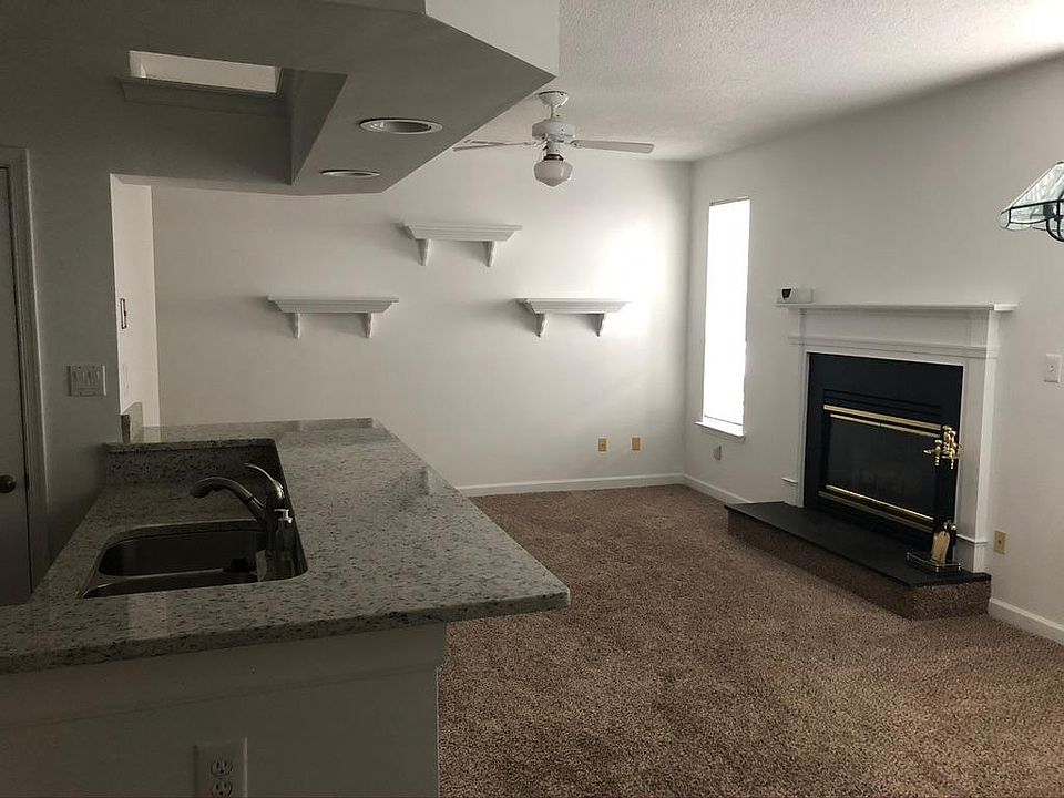 Fresh and clean! Kitchen bar area flows into living space.