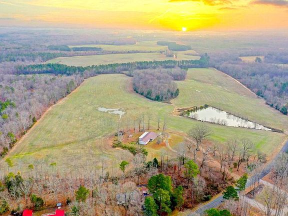 9611 Rollins Rd. 289 +/- Acres of Rolling Agriculture fields; a 1.2 acre pond; with a 3 Bdrm, 3 Ba rental home / hunting lodge (sold as is).
