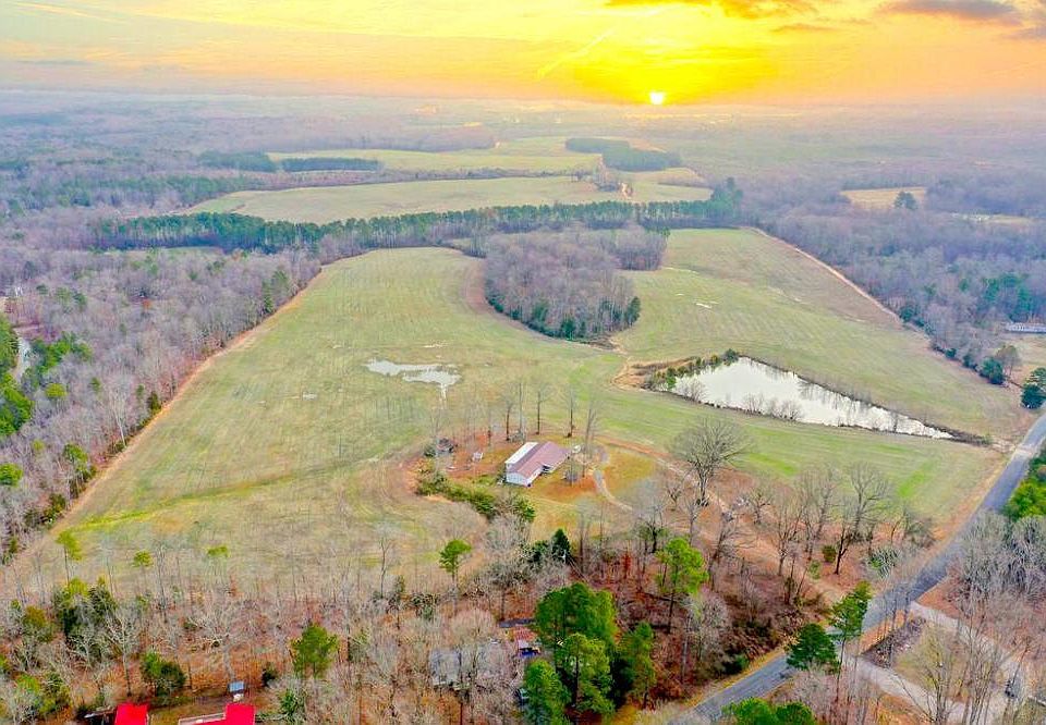 9611 Rollins Rd. 289 +/- Acres of Rolling Agriculture fields; a 1.2 acre pond; with a 3 Bdrm, 3 Ba rental home / hunting lodge (sold as is).