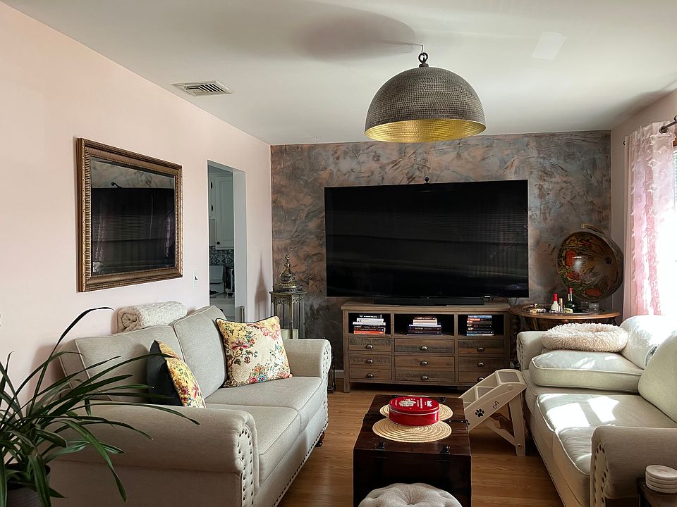 Living room area located in front of house.