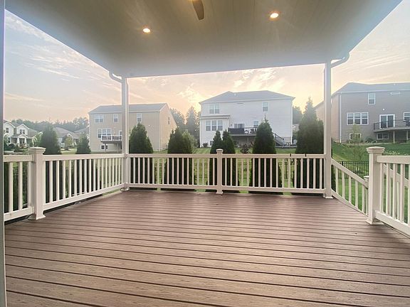 16x16 composite wood covered deck with recessed lights and outdoor fan. Covered deck is suitable for family dinner, grilling, lounging, and entertaining guests. Enjoying outdoor longer than most people. Sunny backyard.