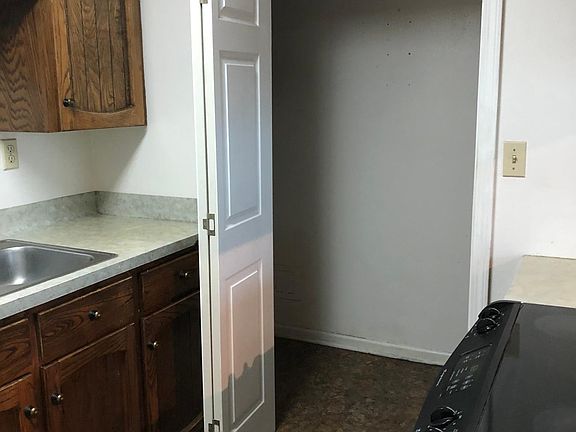 Laundry closet off kitchen. Washer and dryer included.