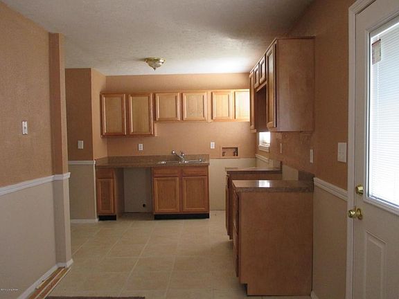 Kitchen with tile flooring, new door