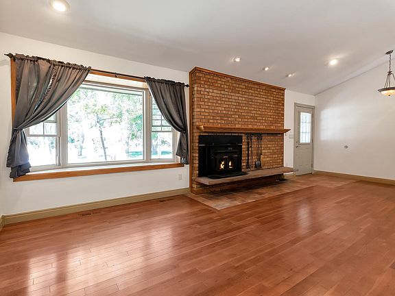 Warm and inviting living area w/ fireplace