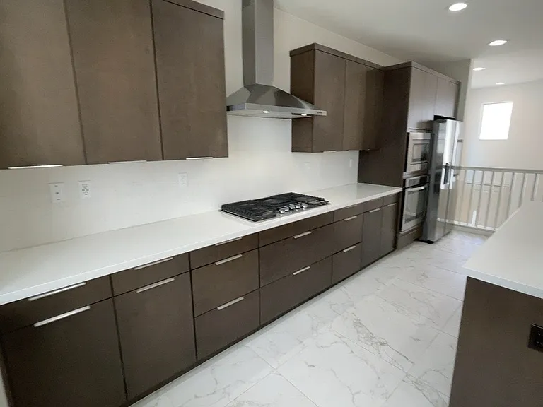 2nd floor - Great room - Kitchen, living room, under-stair storage, bathroom, balcony/patio