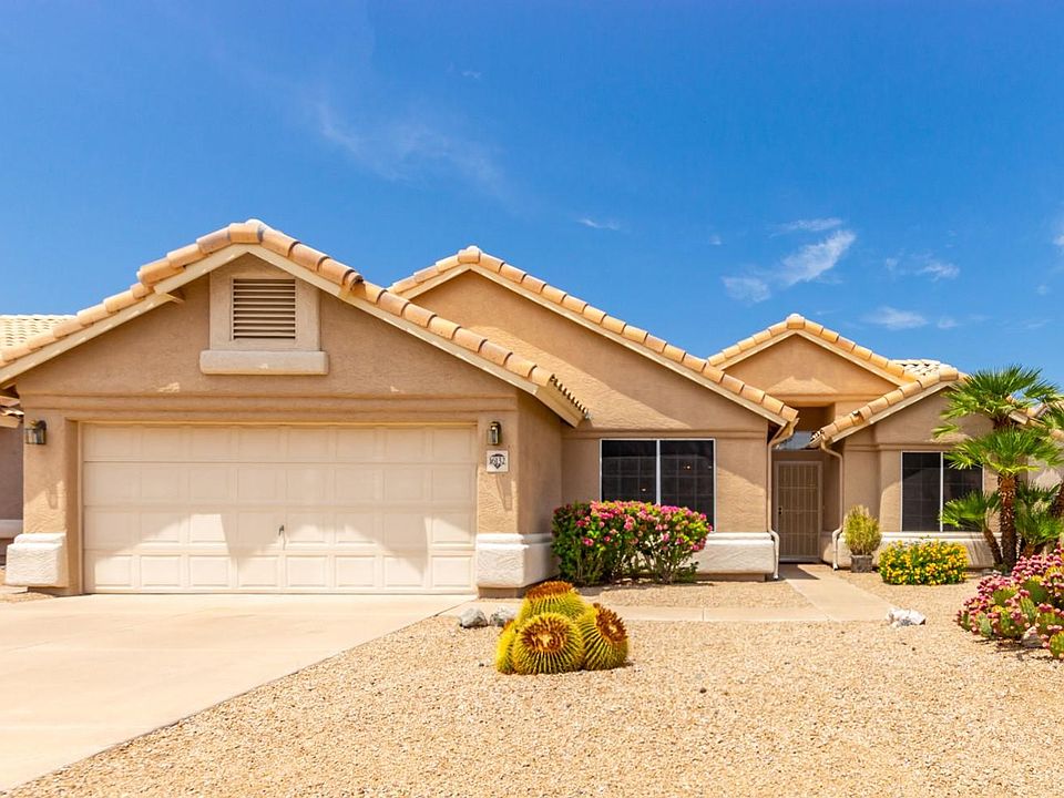 Spacious lot with large 2 car garage and driveway. Beautiful low maintenance landscape.