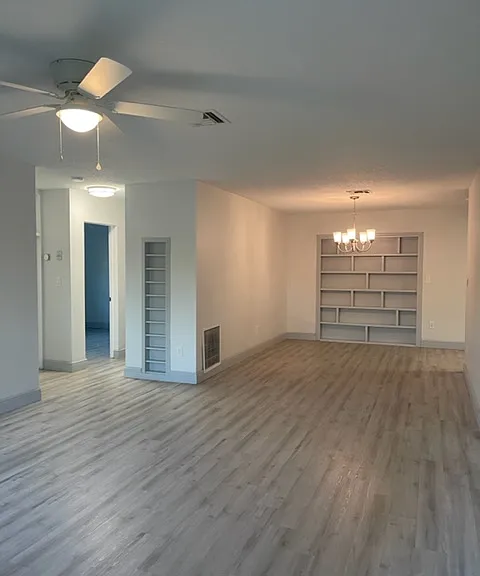 Looking in from front door. Built in shelves.