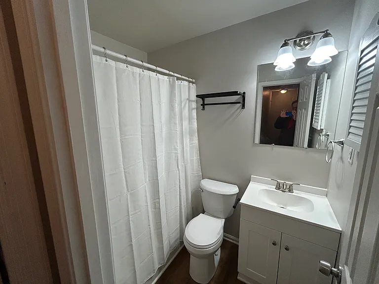 Full bath w/ new toilet and vanity.
