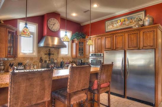 Entertainers kitchen with wolf hood two refrigerator/freezer