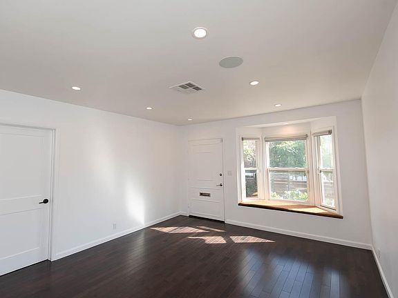 Sun filled living room with window seat