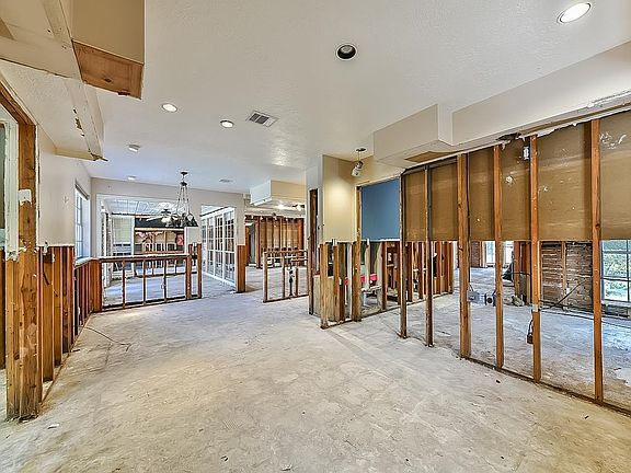 View of Kitchen & breakfast room towards sun porch & featuring entry to adjoining formal dining room.