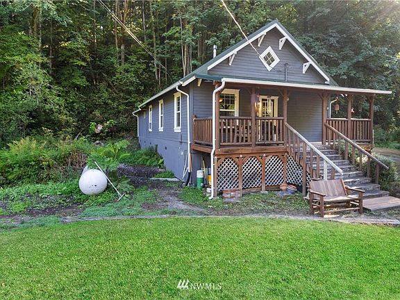 New metal roof, re-supported entry porch.  Home's foundation is post and pillar with a generous crawlspace and room to store garden tools under porch. 