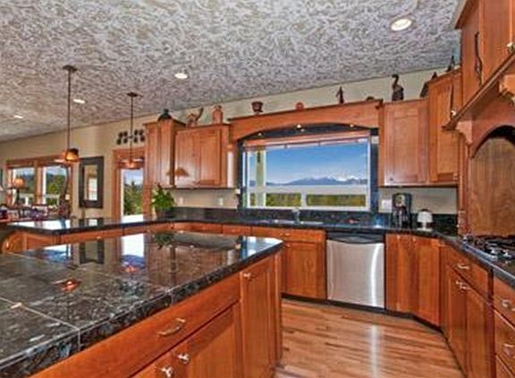 magnificent view through kitchen window. under the cabinet lighting,Dual ovens, gas (propane) stove 