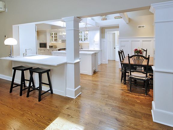 Kitchen has vaulted ceiling with skylights and beams