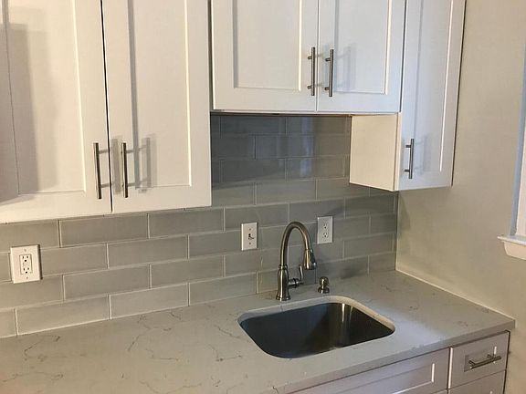 Love your kitchen-soft close hinges, glass subway tiles, quartz counters, stainless steel appliances