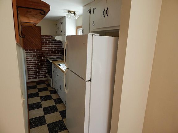 Galley style kitchen. Stove and refridgerated included.