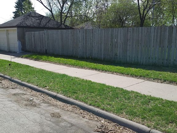Side fence and storage garage