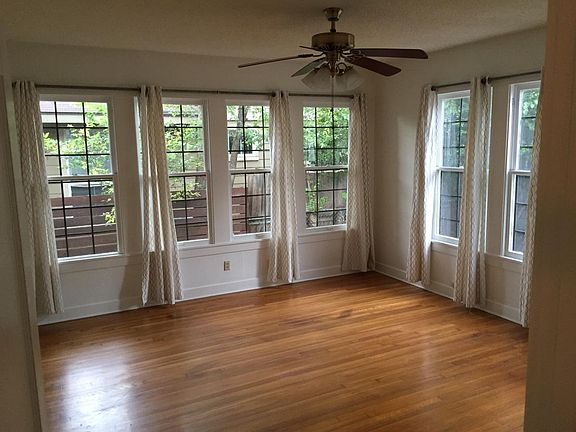 Back bedroom with windows and ceiling fan