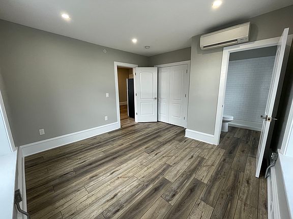 Bedroom. Closet contains washer/dryer and closet storage system.