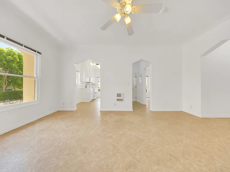 Living room looking into kitchen and dressing area