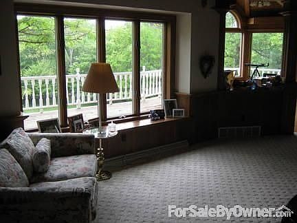 Family Room : Gas fireplace. Wood paneled ceiling. Excellent view.