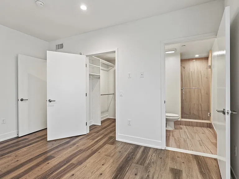 Bedroom with Bathroom and Walk-In Closet