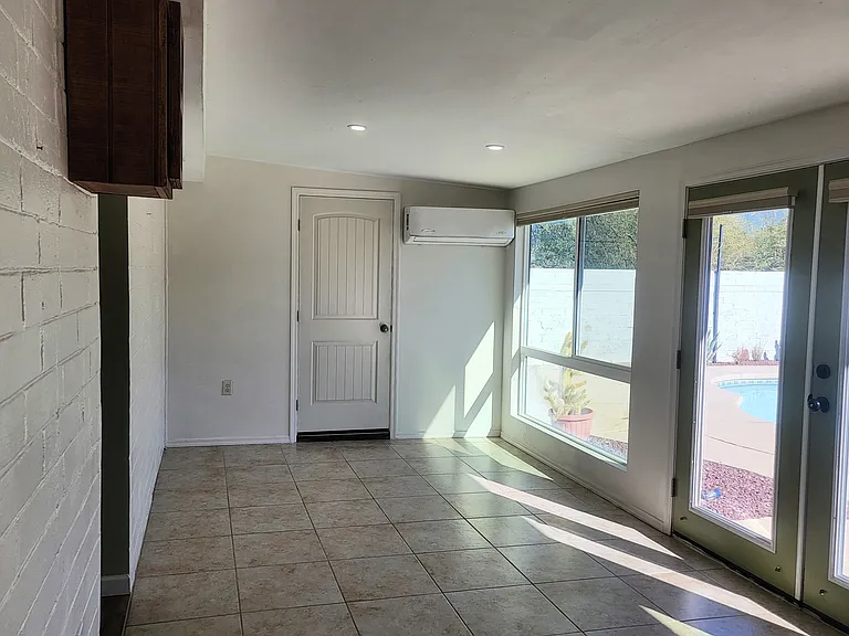 Arizona Room - Leads to Laundry Room & Backyard. TONS of natural light, blinds on each window.