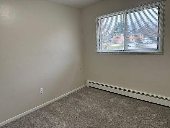 Bedroom 1 with new carpet and new mini blinds