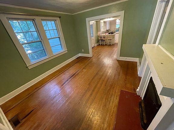 From the front door, this is the living room looking through dining room into the eat-in kitchen.