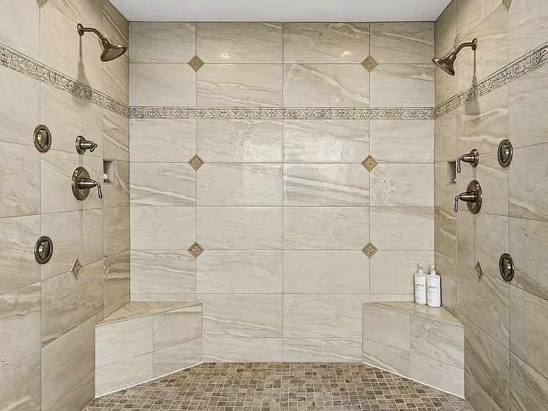 Shower with dual shower heads and body sprayers