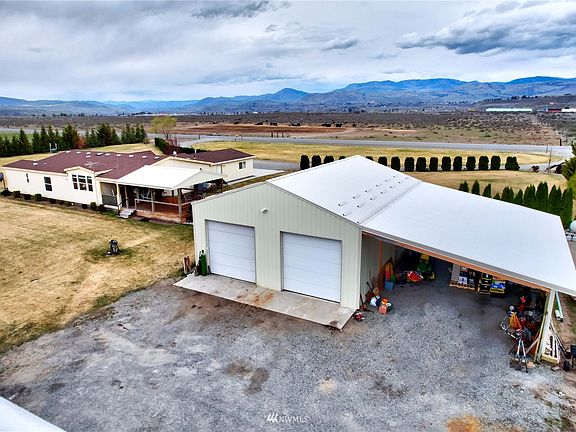 Massive Shop for all your toys and projects. 55x30 heated shop with attached 20X30 fully finished work space and 24 X40 lean-to. An additional half bath is also conveniently inside the shop.