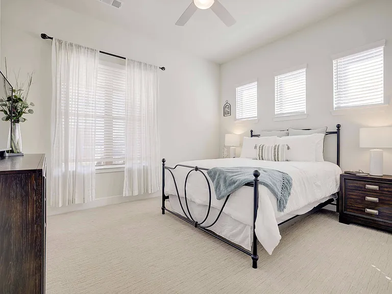 Spacious bedroom with carpet flooring