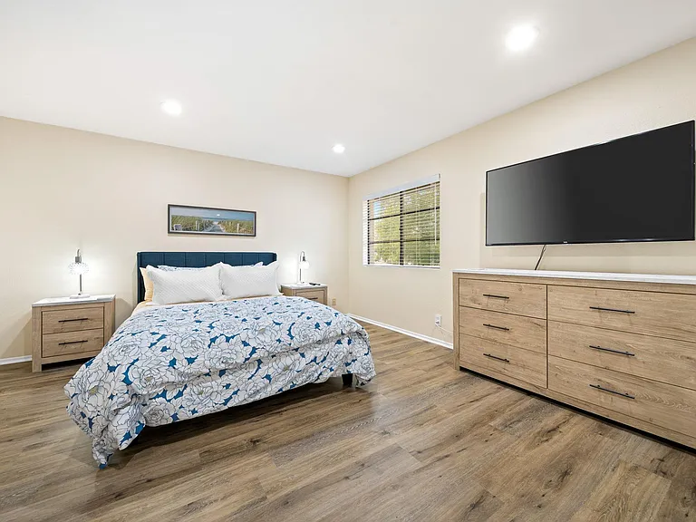 Primary bedroom with smart TV.