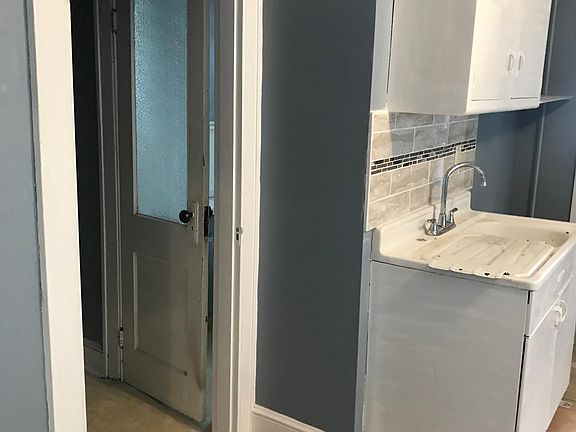 kitchen view toward pantry and bathroom view