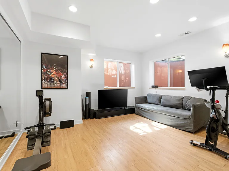 cardio section of gym in basement