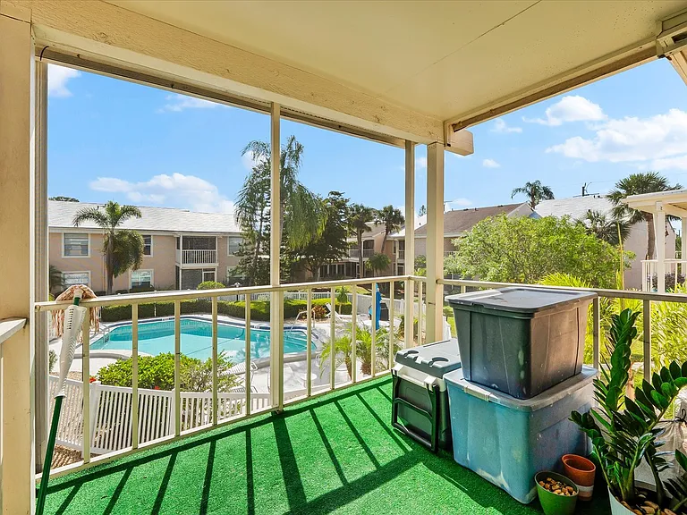 Screened in Lanai with pool view.
